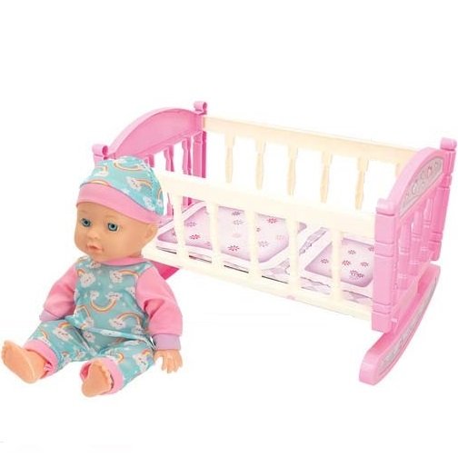 Muñeca bebé con cuna